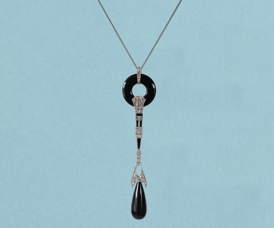 Art Deco onyx and diamond pendant” brooch